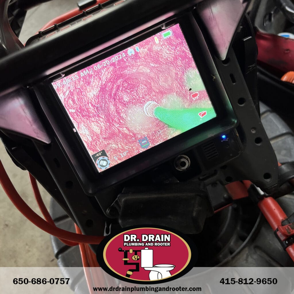 Plumber using infrared camera for leak detection in San Francisco residential property
