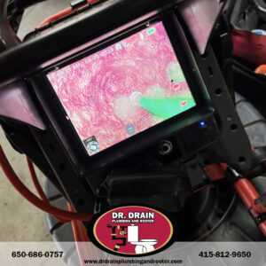 Plumber using infrared camera for leak detection in San Francisco residential property