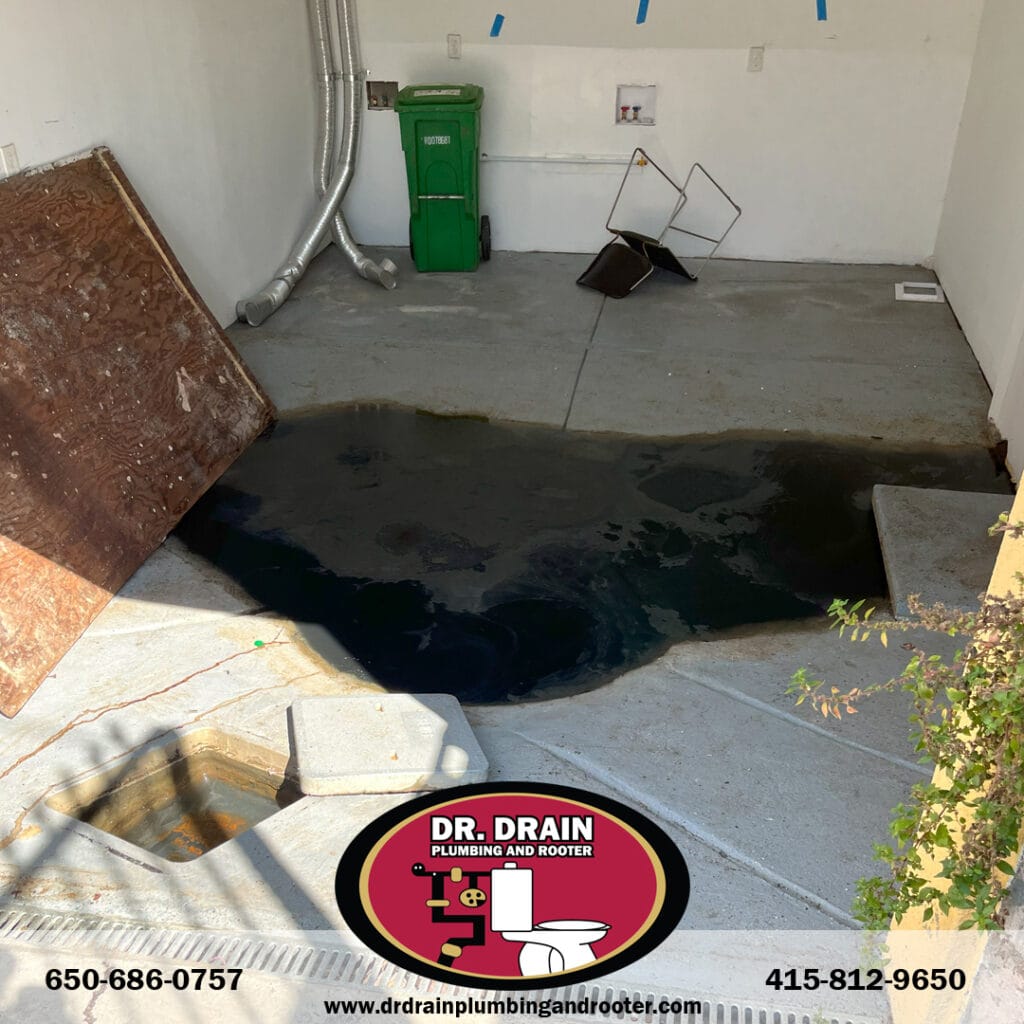 Emergency plumber fixing burst pipe in San Francisco home at night