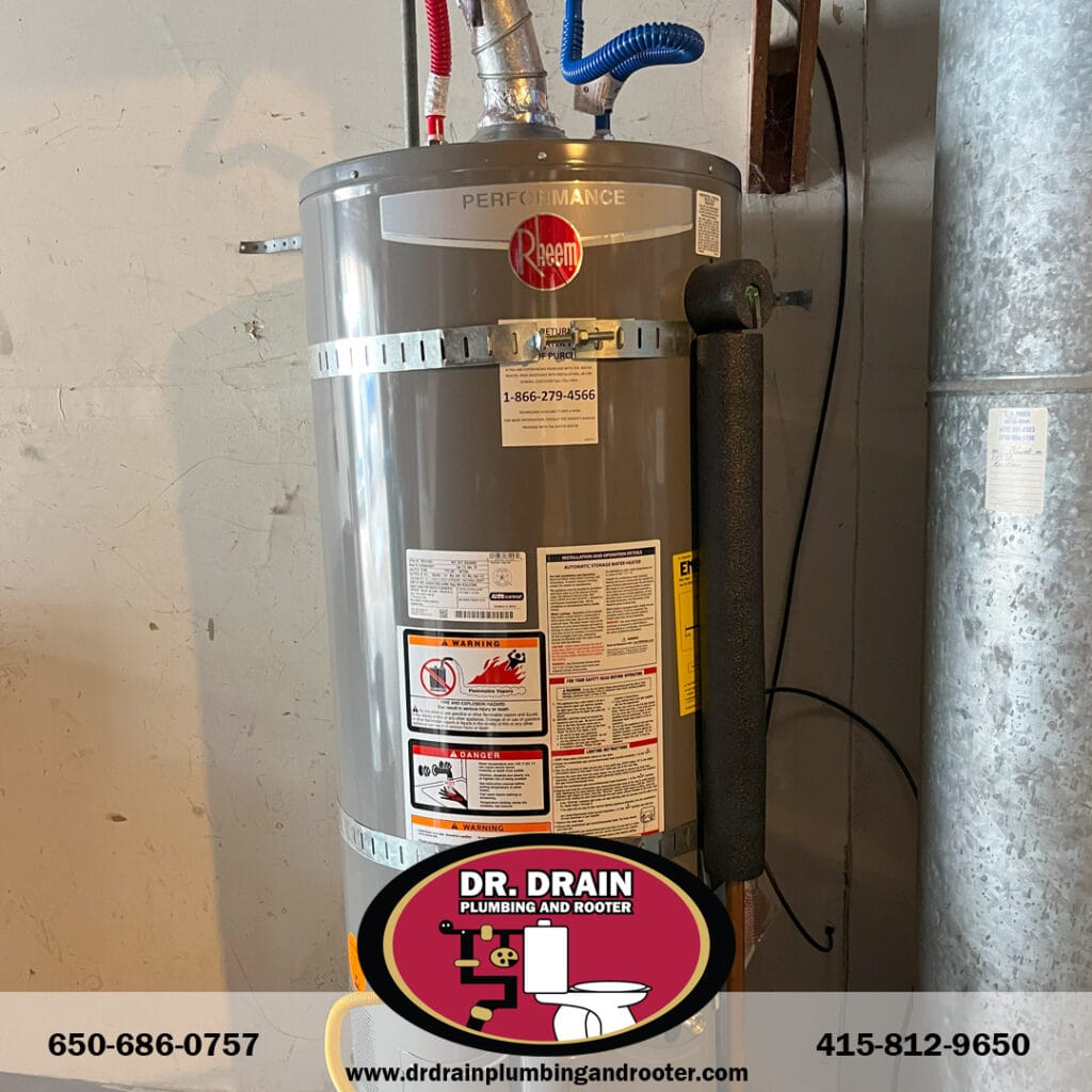 Licensed plumber installing new water heater in San Francisco basement